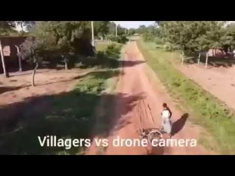 hilarious as villagers run away from a drone camera.